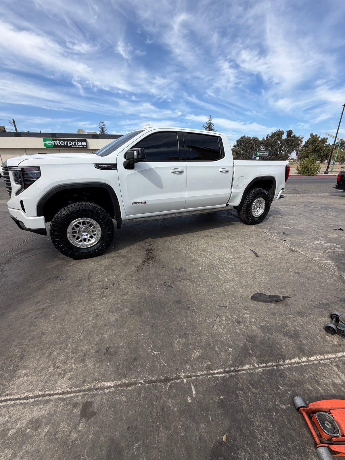 GMC Sierra 1500 AT4 on KMC KM549 GRS Gloss Silver Machined wheels with all-terrain tires