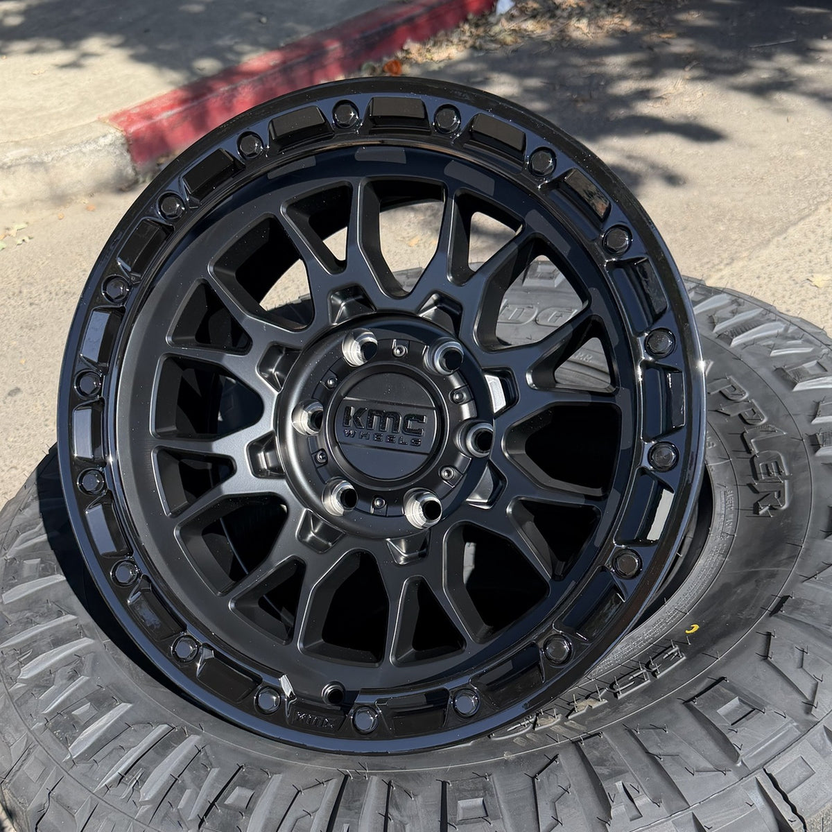 KMC KM558 Imperial Matte Black wheel, angled view