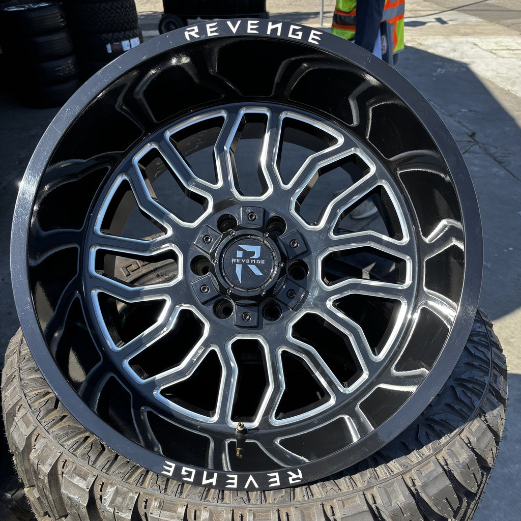 Revenge Off-Road RV-205 20x12 black milled wheel mounted on tire