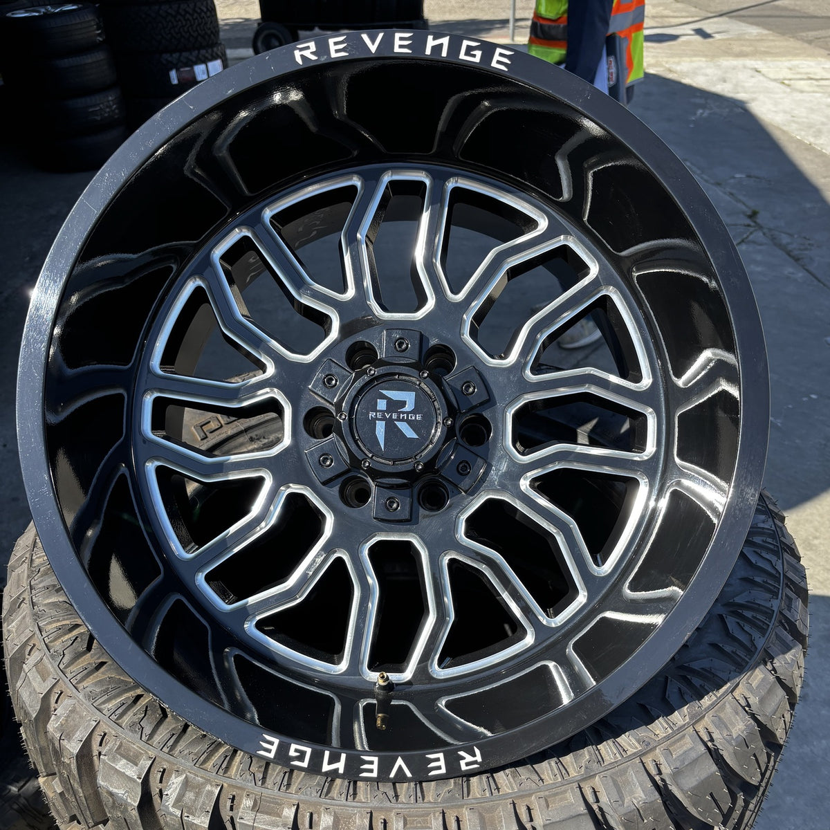 Revenge Off-Road RV-205 20x12 black milled wheel mounted on tire